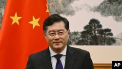 FILE - Then-Chinese Foreign Minister Qin Gang, shown attending a meeting in Beijing, told his Israeli and Palestinian counterparts in phone calls on April 17, 2023, that China was ready to help facilitate peace talks between the two sides.