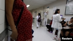 A pregnant woman waits for a routine general checkup, which includes Zika screening, at the maternity ward of the Hospital Escuela in Tegucigalpa, Honduras, Jan. 27, 2016. 