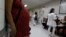 A pregnant woman waits for a routine general checkup, which includes Zika screening, at the maternity ward of the Hospital Escuela in Tegucigalpa, Honduras, Jan. 27, 2016. 