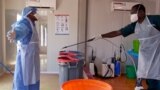 A doctor of International Medical Corps is disinfected at the isolation ward of Ministry of Health Infectious Disease Unit in Juba, South Sudan, April 24, 2020. 