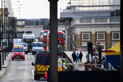 Cars and buses are seen stationary on London Bridge in London, Dec. 1, 2019, as police forensic work is completed following Friday's terror attack. A man wearing a fake suicide vest was subdued by bystanders as he went on a knife rampage…