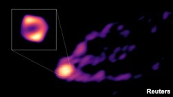 This image shows the jet and shadow of the black hole at the center of the M87 galaxy together for the first time. (NRAO/AUI/NSF/Handout via REUTERS)