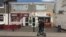 Men walk past a Polish restaurant in Boston, Britain, June 27, 2016. 