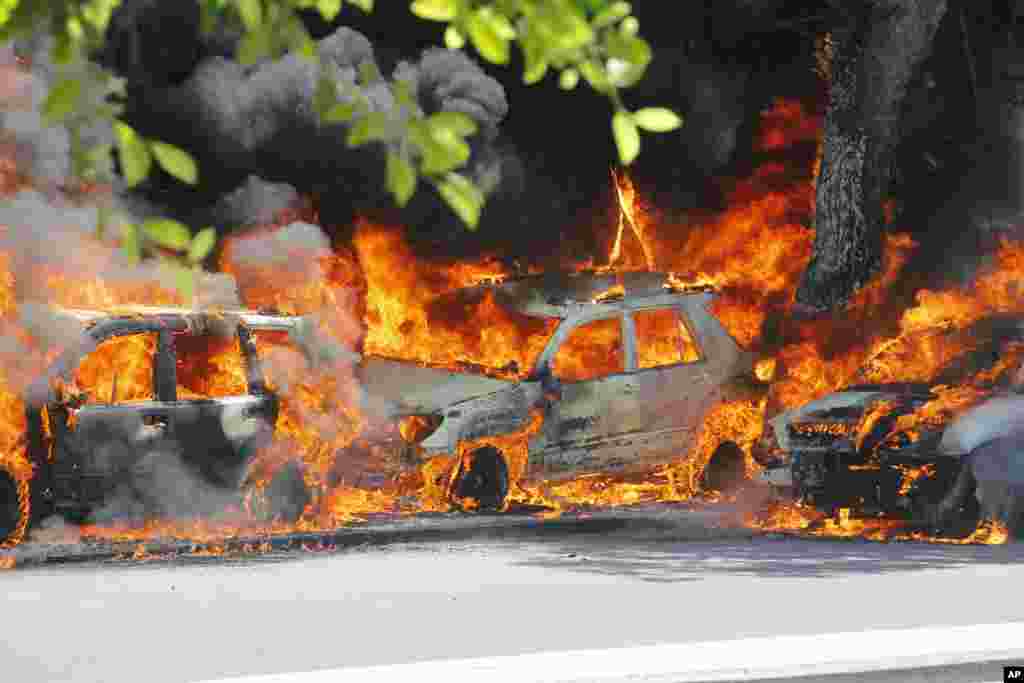 Cars burn after a powerful car bomb is detonated in Mogadishu, Somalia.