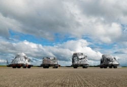 FILE - Medical supplies are seen on the tarmac before being loaded to an aircraft chartered by the U.N. World Food Program to help developing countries hit by the coronavirus outbreak, at Liege airport, Belgium, April 30, 2020.