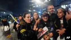 FILE - Former hostage Ilana Grisewsky, center, takes part in a protest calling on Israel's government to return the remaining abductees held by Hamas in Gaza on Feburary 22, 2024.