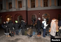 Journalists and press photographers stand outside the Swedish Foreign Ministry, waiting for North Korea's Foreign Minister Ri Yong Ho and his delegation to arrive, in Stockholm, Sweden, March 15, 2018.