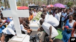 Relatives and friends gather during the funeral of Patrick Ndikumana, July 3, 2015, in Bujumbura, Burundi.