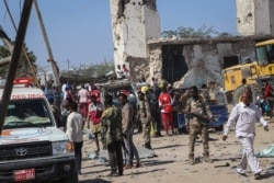 FILE - Somali soldiers secure the scene of a car bomb attack in Mogadishu, Somalia, Dec. 28, 2019.