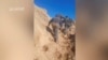 FILE - Hamas militants scale a hill a at a location given as Juhr Al-Dik, Gaza, in this still image from video said to be from Dec. 15, 2023. Some Chinese vloggers depict Hamas as heroic and capable on the battlefield. Hamas Military Wing via REUTERS 