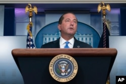 FILE - Health and Human Services Secretary Alex Azar said the new strategy would not interfere with Americans waiting for a first dose.