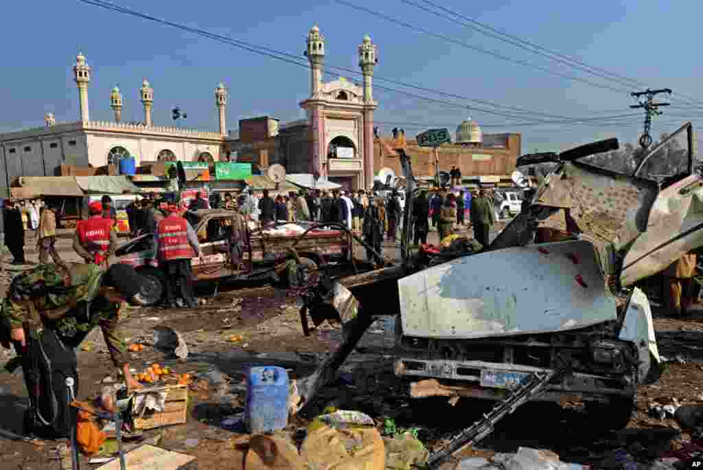 Pakistani security personnel examines the site of a bomb blast in Jamrud, January 10, 2012. (AFP)