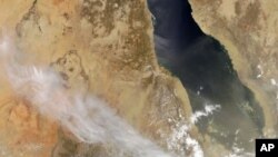 A natural-color image released by NASA shows plumes billowing from Nabro volcano in Eritrea on June 13, 2011