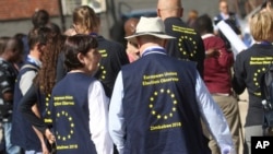 FILE: European Union Observers are seen outside a local hotel in Harare, Saturday, June, 23, 2018.The European Union has deployed election observers in Zimbabwe for the first time in 16 years as the country prepares for its first vote since independence without longtime leader Robert Mugabe. (AP Photo/Tsvangirayi Mukwazhi)