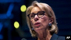 FILE - Education Secretary Betsy DeVos speaks during a student town hall at National Constitution Center in Philadelphia, Monday, Sept. 17, 2018.