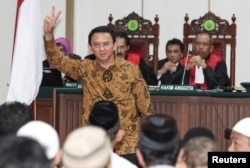 FILE - Jakarta's Governor Basuki "Ahok" Tjahaja Purnama gestures inside the courtroom during his blasphemy trial in Jakarta, Indonesia, Jan. 3, 2017.