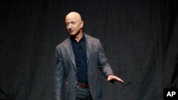 Jeff Bezos speaks at an event before unveiling Blue Origin's Blue Moon lunar lander, Thursday, May 9, 2019, in Washington. (AP Photo/Patrick Semansky)