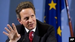 U.S. Treasury Secretary Timothy Geithner briefs the media during a news conference with German Finance Minister Wolfgang Schaeuble after a meeting at the finance ministry in Berlin, Tuesday, Dec. 6, 2011.