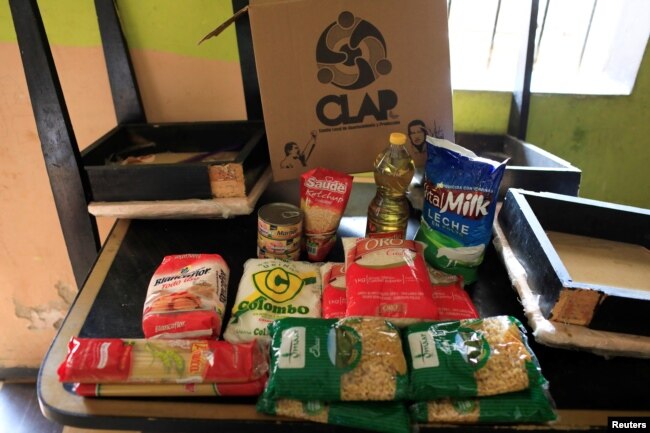 The contents of a CLAP box, a Venezuelan government handout of basic food supplies, is pictured at Viviana Colmenares' house in the slum of Petare in Caracas, Venezuela, Feb. 23, 2018.