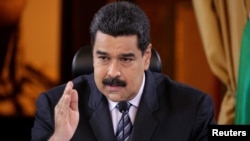 Venezuela's President Nicolas Maduro speaks during an agreement signing ceremony with representatives of oil companies: Venezuelan Delta Petroleum and India's ONGC Videsh Limited, in Caracas, Venezuela, Nov. 4, 2016. 