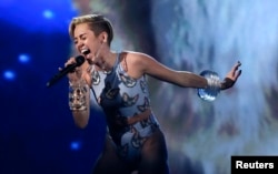 Miley Cyrus performs "Wrecking Ball" at the 41st American Music Awards in Los Angeles, California, Nov. 24, 2013.