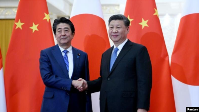 中国国家主席习近平23日在北京人民大会堂接见日本首相安倍晋三