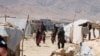 FILE - Internally displaced Afghans at a camp outside Kabul, Afghanistan, during a visit by United Nations Secretary-General Antonio Guterres June 14, 2017. UN refugee agency estimates eight million Afghans do not live in their homes, fleeing deadly conflict, poverty, unemployment and a worsening drought in Afghanistan.