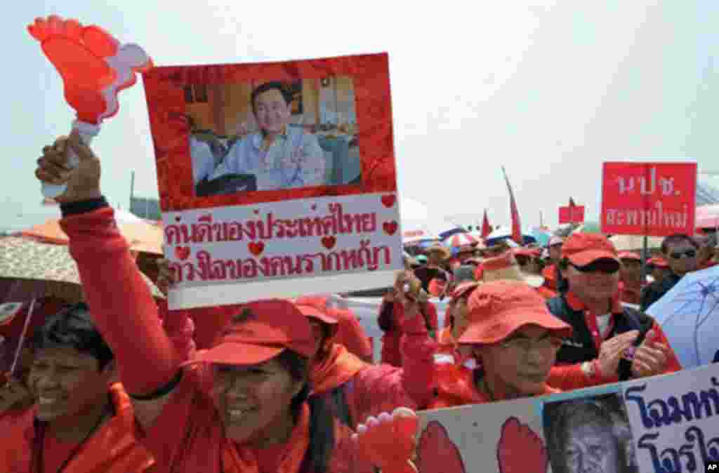 Supporters of deposed Thai premier Thaksin Shinawatra shout slogans during a protest in Bangkok on March 12, 2010.