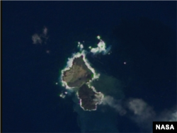 Niijima and Nishino-shima appear to be almost touching in this December 24 image taken by a NASA satellite.