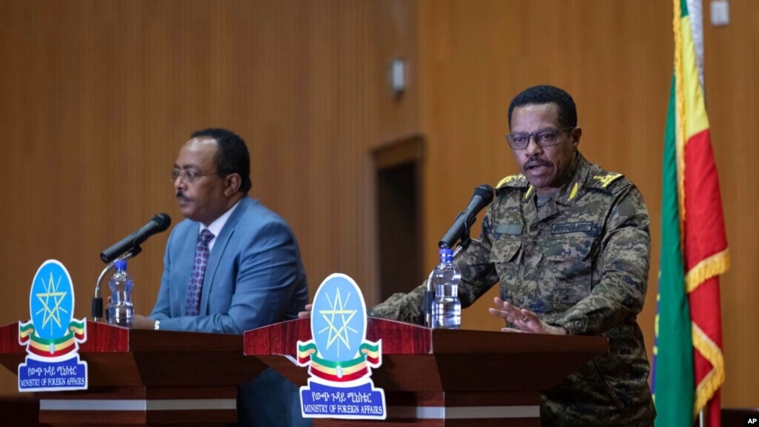 Lt. Gen. Bacha Debele of the Ethiopian National Defense Force, right, gives a press conference with Redwan Hussein, spokesperson for the Tigray task force, about the situation in the country's Tigray region, in Addis Ababa, Ethiopia, June 30, 2021.