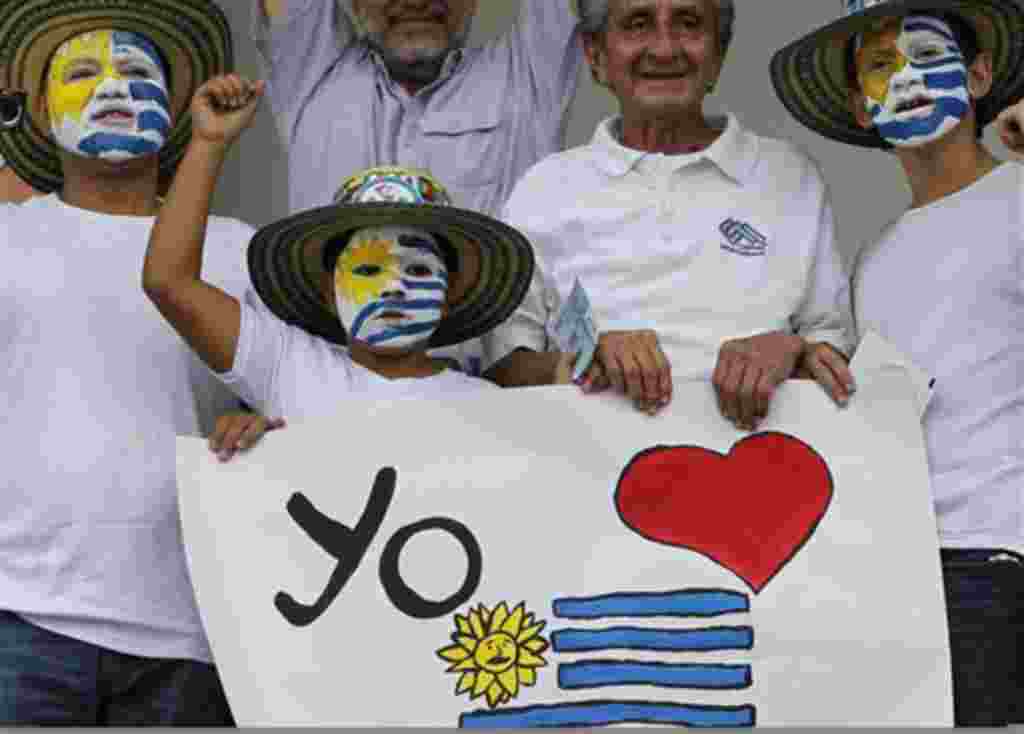 Uruguay's soccer fans cheer their team before a U-20 World Cup group B soccer match against New Zealand in Cali, Colombia, Tuesday, Aug. 2, 2011. (AP Photo/Fernando Vergara)