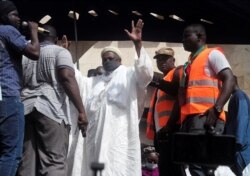 FILE - Imam Mahmoud Dicko greets his supporters during a protest demanding the resignation of Mali's President Ibrahim Boubacar Keita at Independence Square in Bamako, Mali, June 19, 2020.