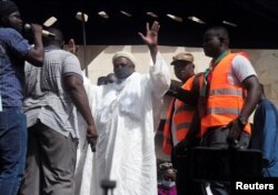 FILE - Imam Mahmoud Dicko greets his supporters during a protest demanding the resignation of Mali's President Ibrahim Boubacar Keita at Independence Square in Bamako, Mali, June 19, 2020.