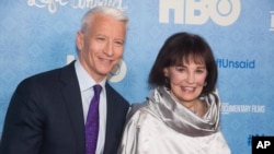 FILE - CNN anchor Anderson Cooper and Gloria Vanderbilt attend the premiere of "Nothing Left Unsaid" at the Time Warner Center in New York. 