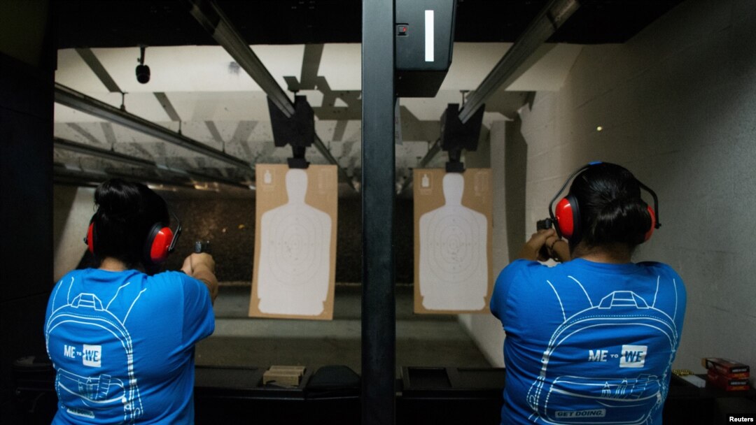 Nicole Navarro (L) and Adriana Retana, who said they wanted to improve their marksmanship after a gunman killed 22 people at a local Walmart, practice shooting at a gun range in El Paso, Texas, Aug. 12, 2019. 
