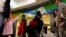 FILE - Passengers line up during a security check ahead of the 2016 Rio Olympics at Congonhas Airport in Sao Paulo, Brazil, July 18, 2016.