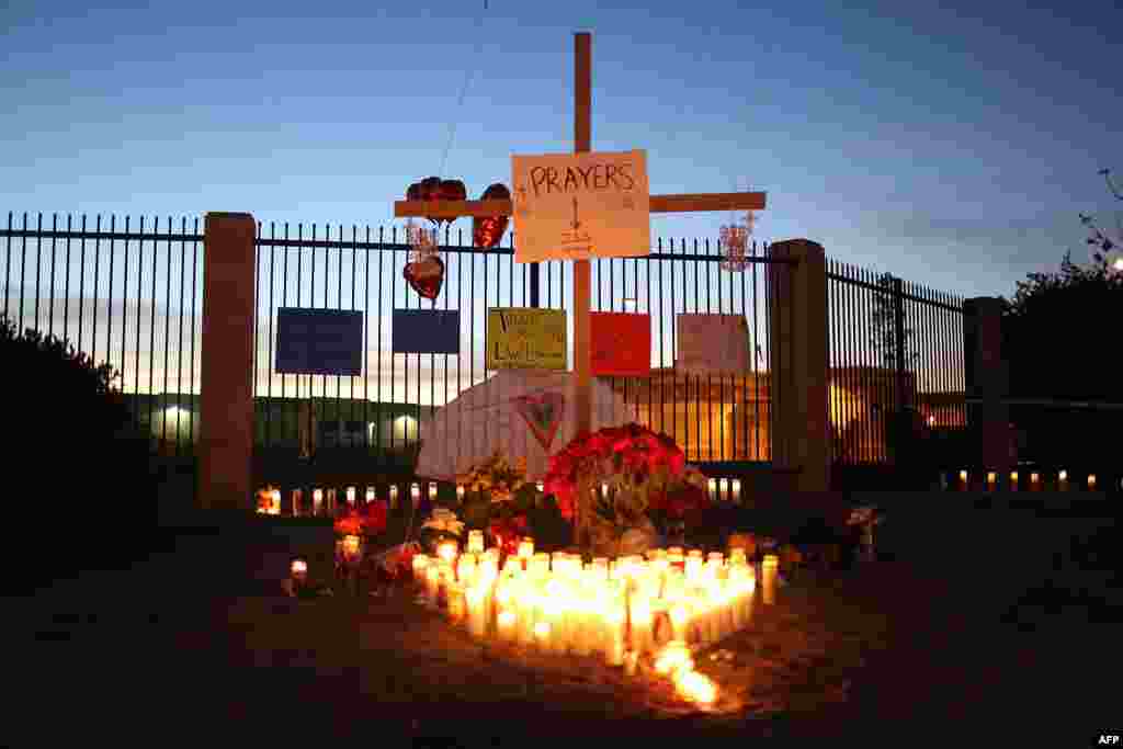 A memorial is seen near the Inland Regional Center as the community remembers those injured and killed during a mass shooting Wednesday at the center in San Bernardino, California.