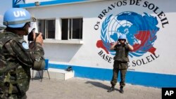 FILE - A U.N. peacekeeper from Brazil poses for a souvenir photo before a patrol in the Cite Soleil slum in Port-au-Prince, Haiti, Feb. 22, 2017.