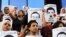 Protesters rally in front of the Press Syndicate in Cairo in support of Al Jazeera journalists Abdullah al-Shami and Mohamed Bader, who were detained by Egyptian authorities.
