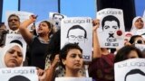 Protesters rally in front of the Press Syndicate in Cairo in support of Al Jazeera journalists Abdullah al-Shami and Mohamed Bader, who were detained by Egyptian authorities.