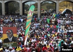 Thousands of supporters of the ruling party Zanu PF gather outside the party headquarters to show support for President Robert Mugabe following a wave of anti-governement protests over the last two weeks in Harare, Zimbabwe on July 20, 2016