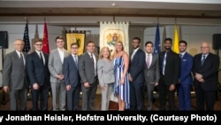 Graduates and school officials at first graduation for dual degree recipients from Hofstra University and China’s Dongbei University of Finance and Economics. (Photo by Jonathan Heisler, Hofstra University) 