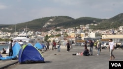 At the port in Lesbos, Greece, many refugees from Afghanistan, Iraq and Syria arrive seeking to go to other places in Europe. (Credit: Heather Murdock/VOA)