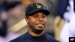 FILE - The Seattle Mariners' Ken Griffey Jr. watches his team take on the Minnesota Twins in Seattle, June 1, 2010 — the day before he announced his retirement.