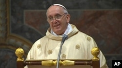 In this image made from video provided by CTV, Pope Francis celebrates his inaugural Mass with cardinals inside the Sistine Chapel at the Vatican, March 14, 2013.