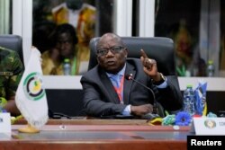 FILE - Abdel-Fatau Musah, ECOWAS commissioner, briefs the press on plans to deploy its standby force to the Republic of Niger, in Accra, Ghana, August 18, 2023.