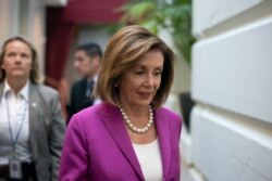 FILE - House Speaker Nancy Pelosi, D-Calif., arrives for a closed-door session with her caucus at the Capitol in Washington, July 16, 2019.