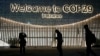 People walk outside the venue for the COP29 U.N. Climate Summit, in Baku, Azerbaijan, Nov. 11, 2024. 