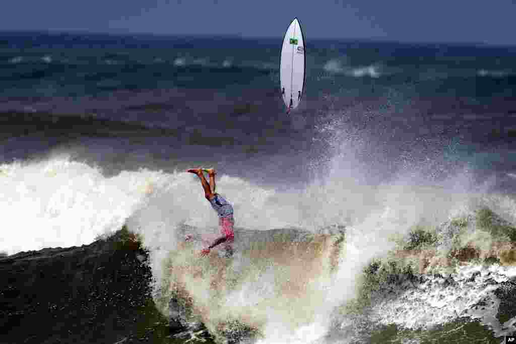 Brazil's Gabriel Medina crashes on a wave during the bronze medal heat of the men's surfing competition at the 2020 Summer Olympics at Tsurigasaki beach in Ichinomiya, Japan.