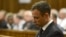 FILE - Oscar Pistorius sits in court, after judge Thokozile Masipais sentenced him to five years in prison, in Pretoria, South Africa, Oct. 21, 2014.